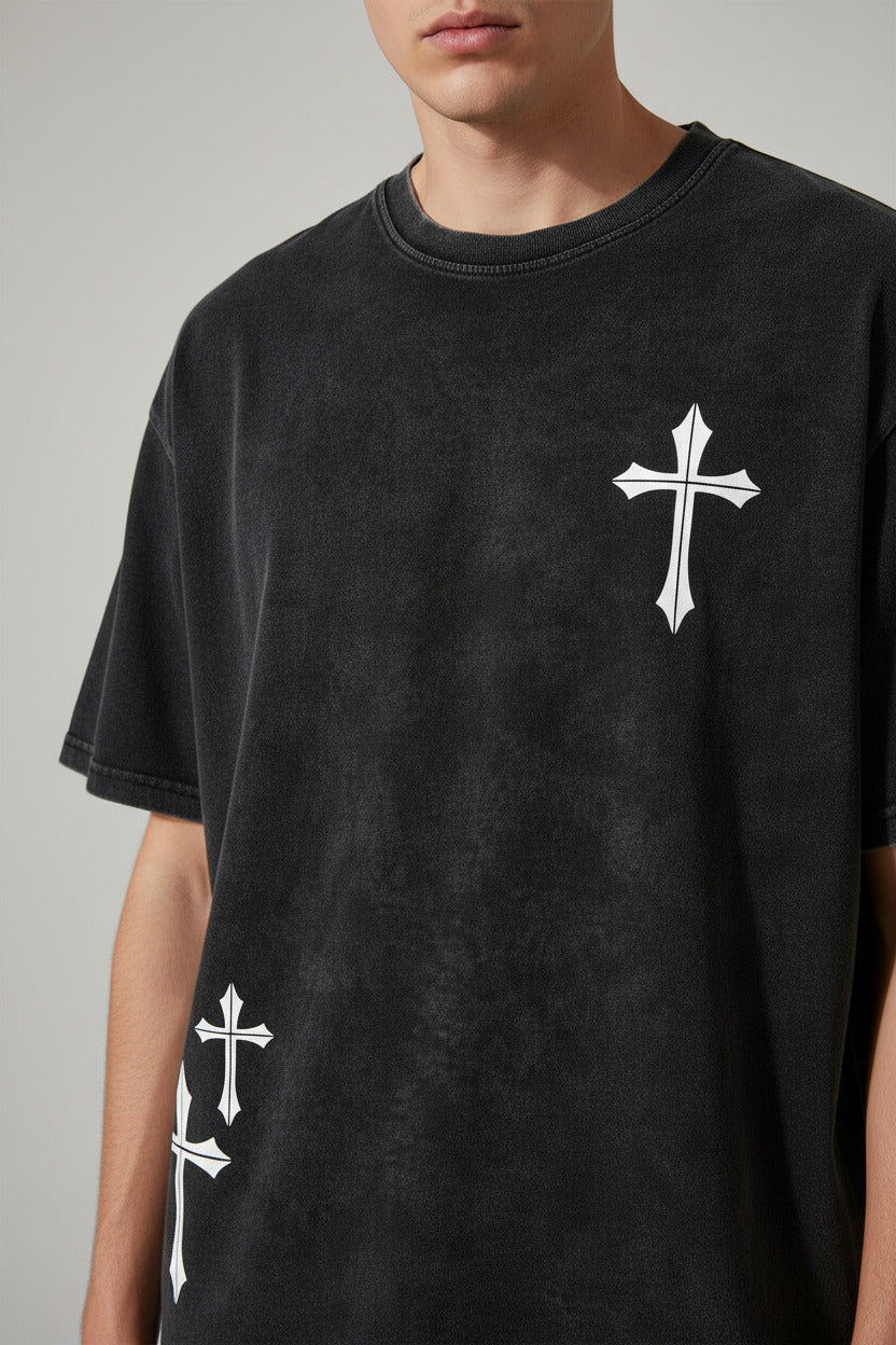 Black t-shirt with white cross designs on a white background