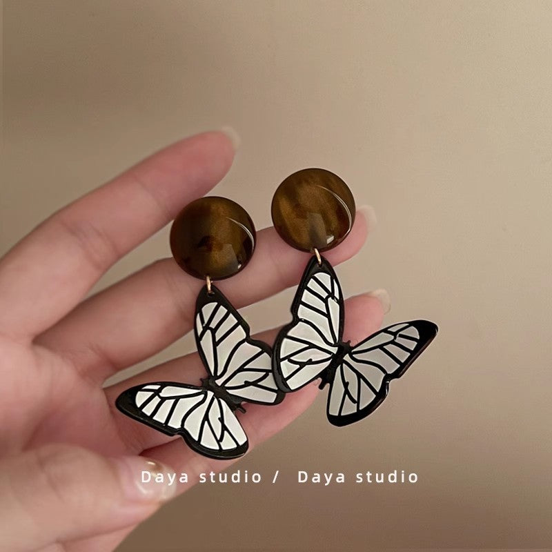 Lirio Charm Bow & Butterfly Earrings