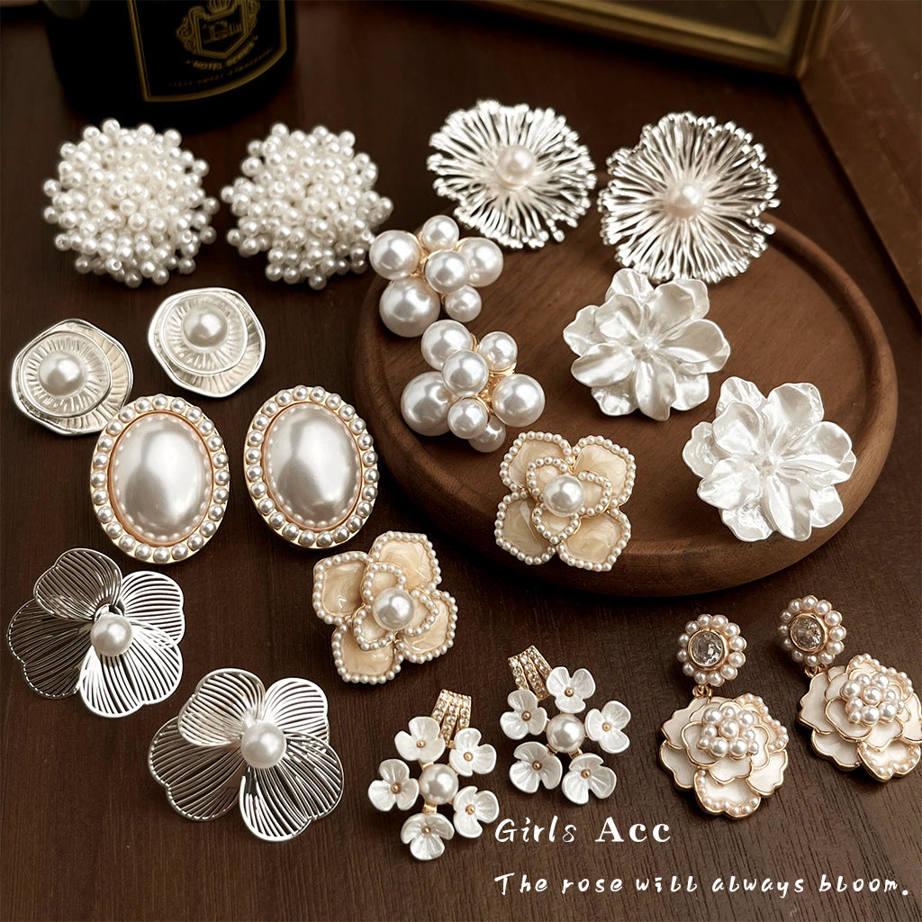 Luxury-style handcrafted pearl flower earrings with artistic retro charm