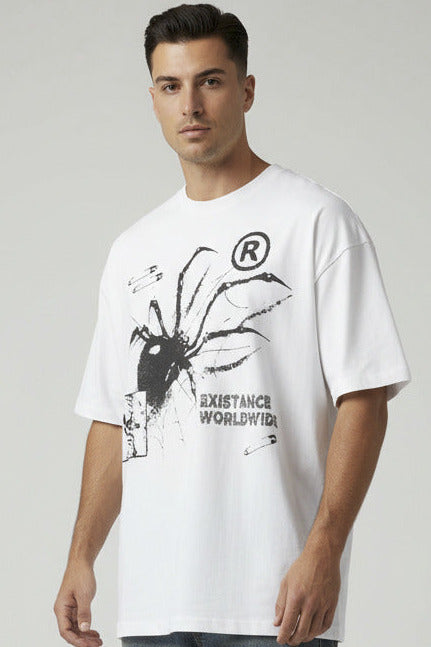 White t-shirt with black graphic design on a textured surface