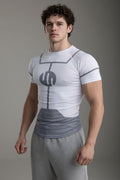 Man wearing a white t-shirt with a gray graphic design on a white background