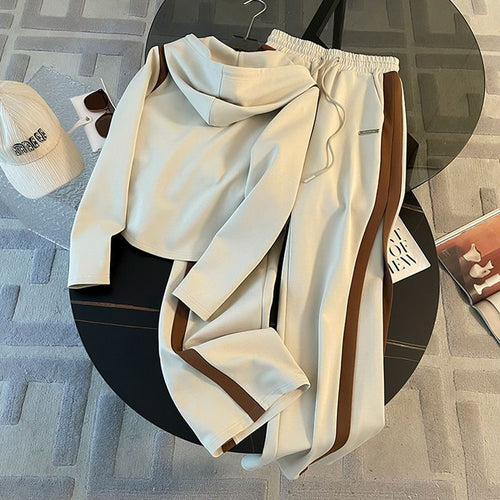 A two-piece hooded sweatshirt and wide-leg pants set
