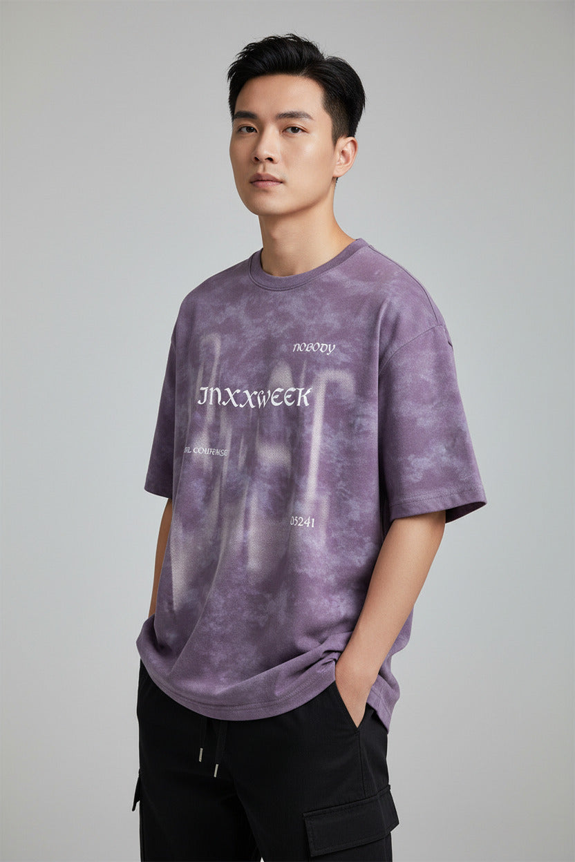 Purple tie-dye sweatshirt with text on a black background