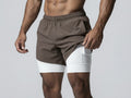 Person holding a smartphone with a white athletic shorts featuring an Apple logo.