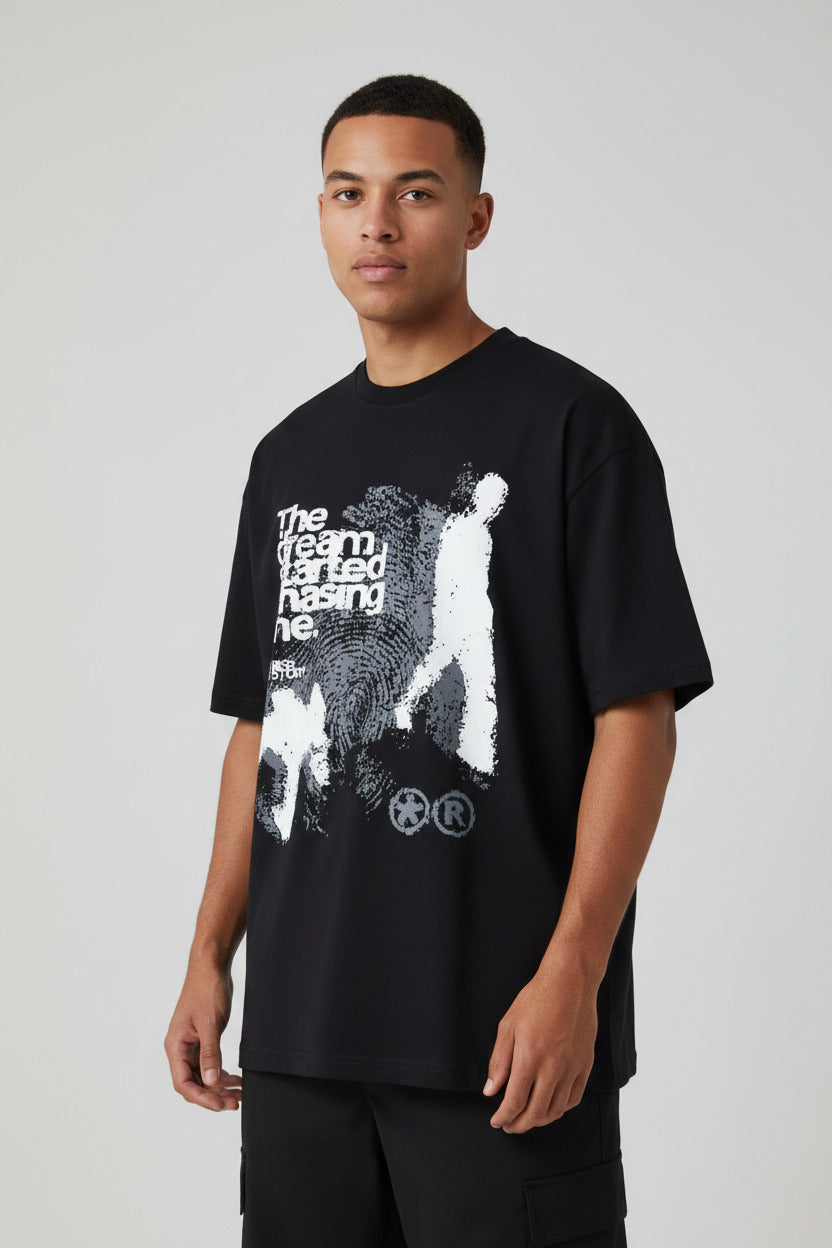 Black t-shirt with white graphic design and text on a white background
