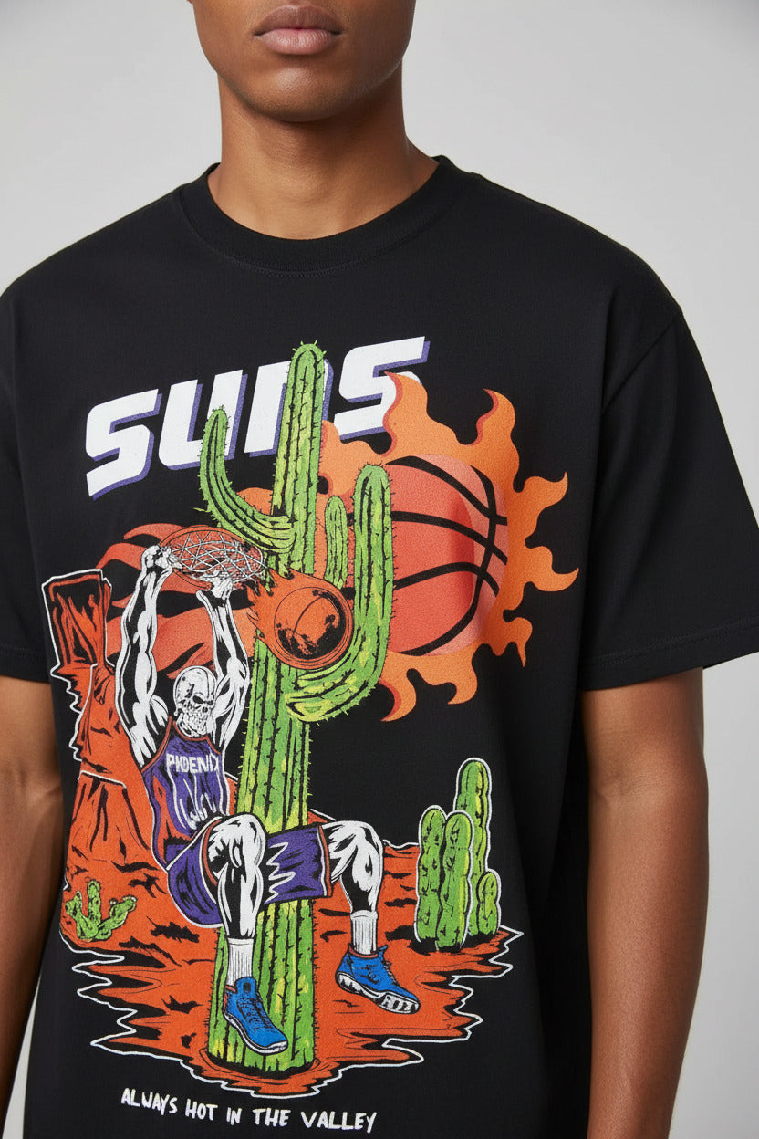 Black t-shirt with colorful graphic design featuring a cactus, sun, and text on a white background