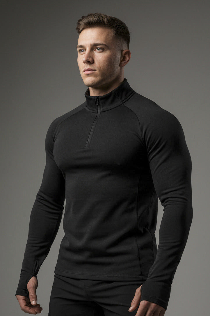 Black long-sleeve shirt with a quarter zip on a white background